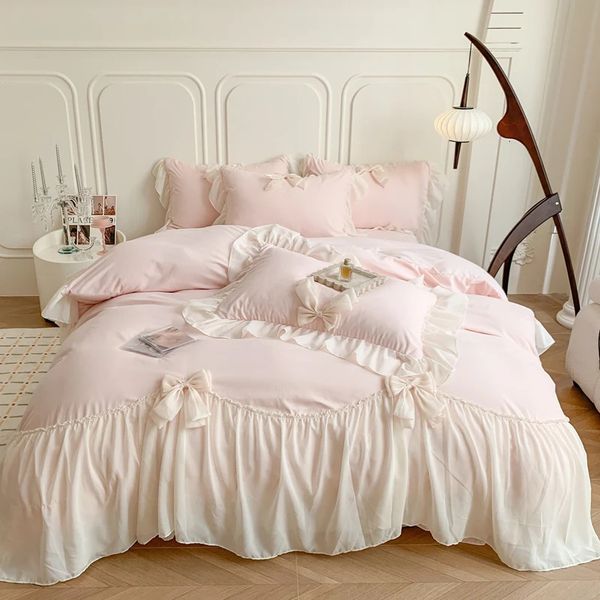 Bedding set in pink romantic French princess style with lace ruffles, bow accents, and soft cozy duvet covers for single, queen, or king beds