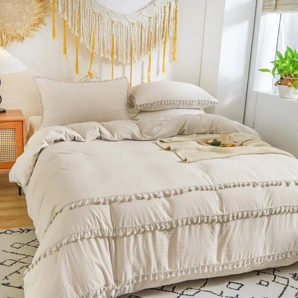 Beige tassel bedding set with ivory duvet cover and light grey tufted fringe for a shabby chic look  

Ivory duvet cover featuring beige tassels and light grey tufted fringe in shabby chic style  
...