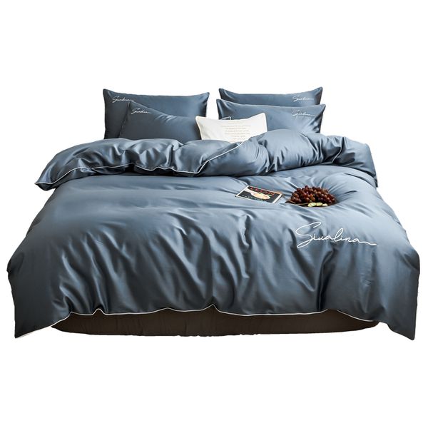 Four-piece bedding set with simple cotton double bed sheets, quilt cover featuring embroidered piping, comfortable and in blue color