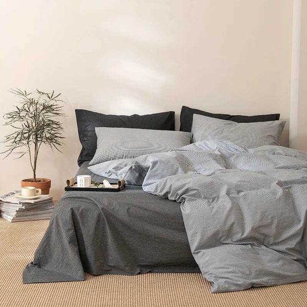 Four-piece quilt set with washed cotton sheets, duvet cover, and dorm bedding in a complete four or three-piece collection