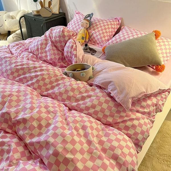 Nordic-style pink and black checkerboard duvet cover sets with matching pillowcases for kids' beds in king, queen, and twin sizes